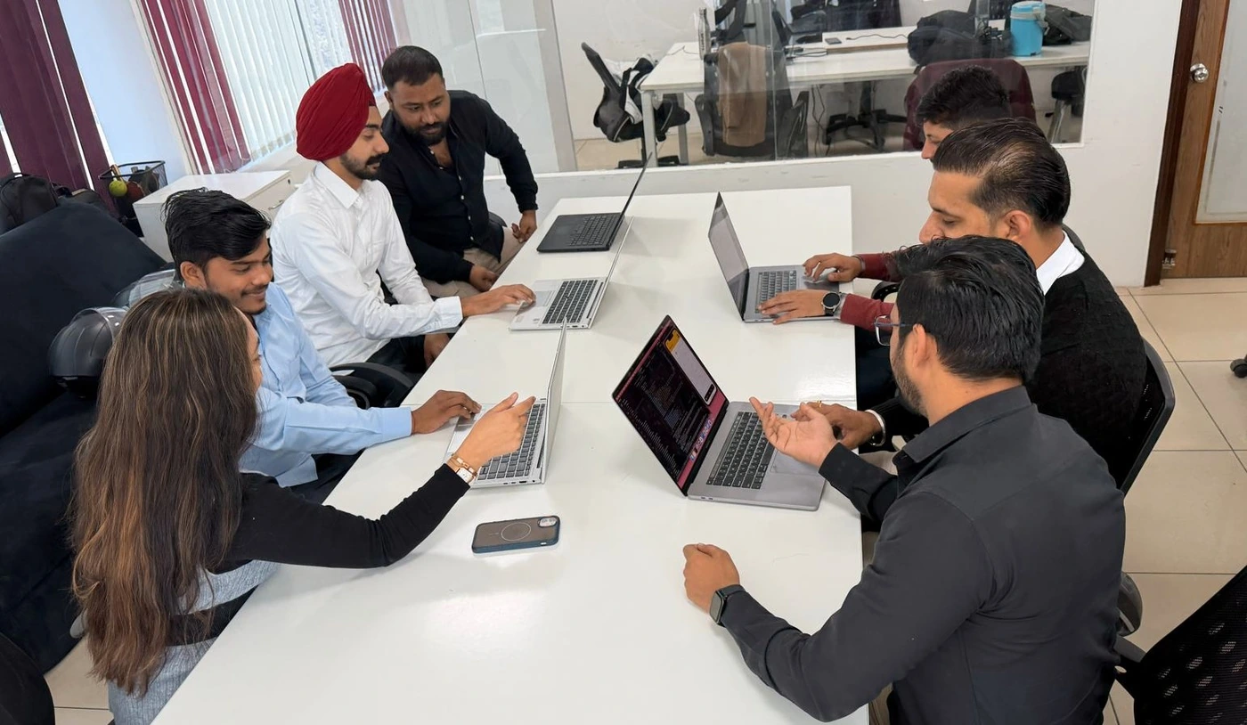 A Red Orange Technologies delivery team in a planning session