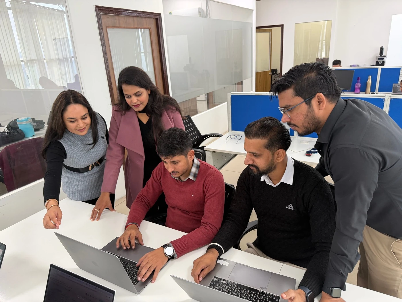 Red Orange Technologies colleagues working together at the office in India